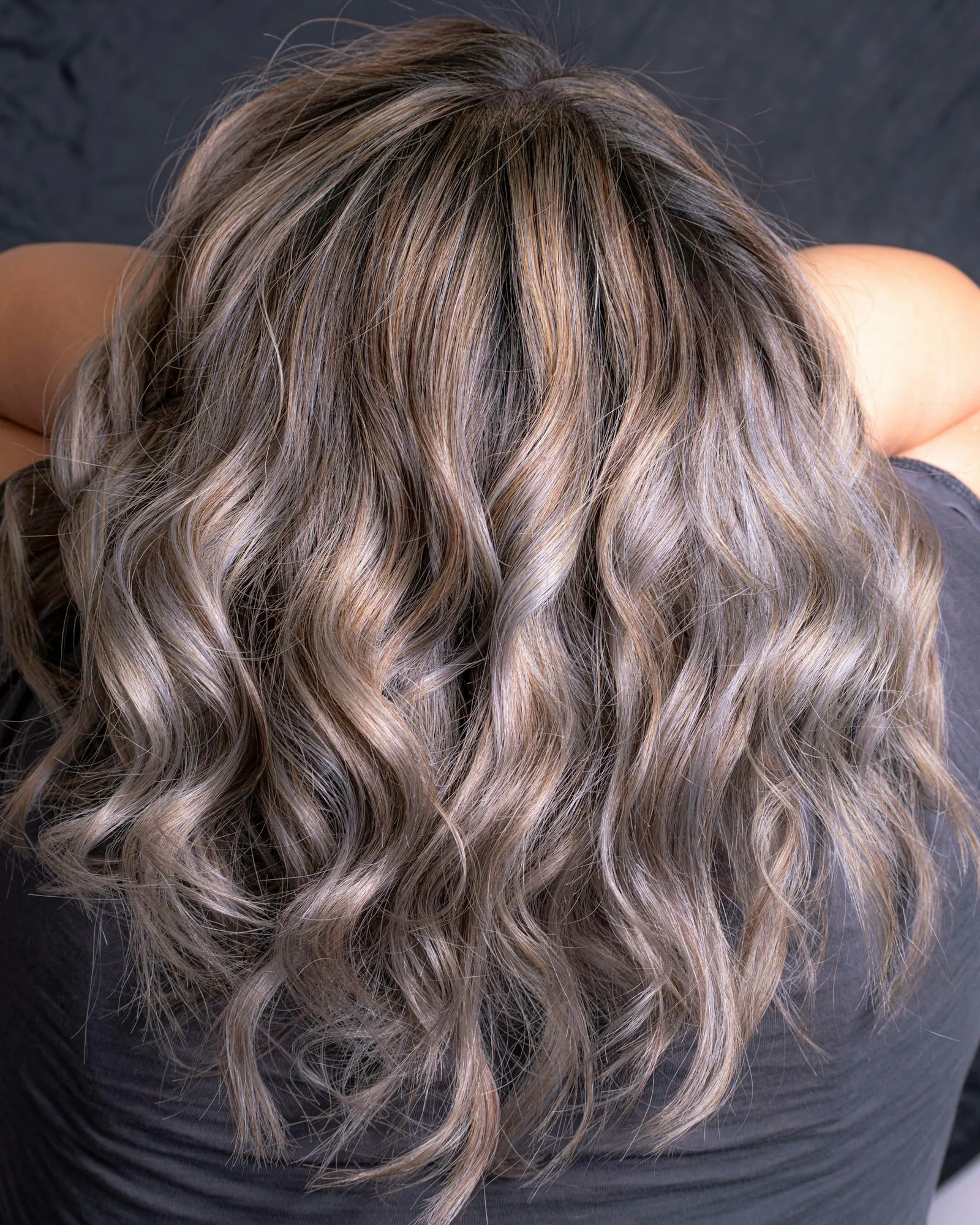 Ash-toned balayage curls