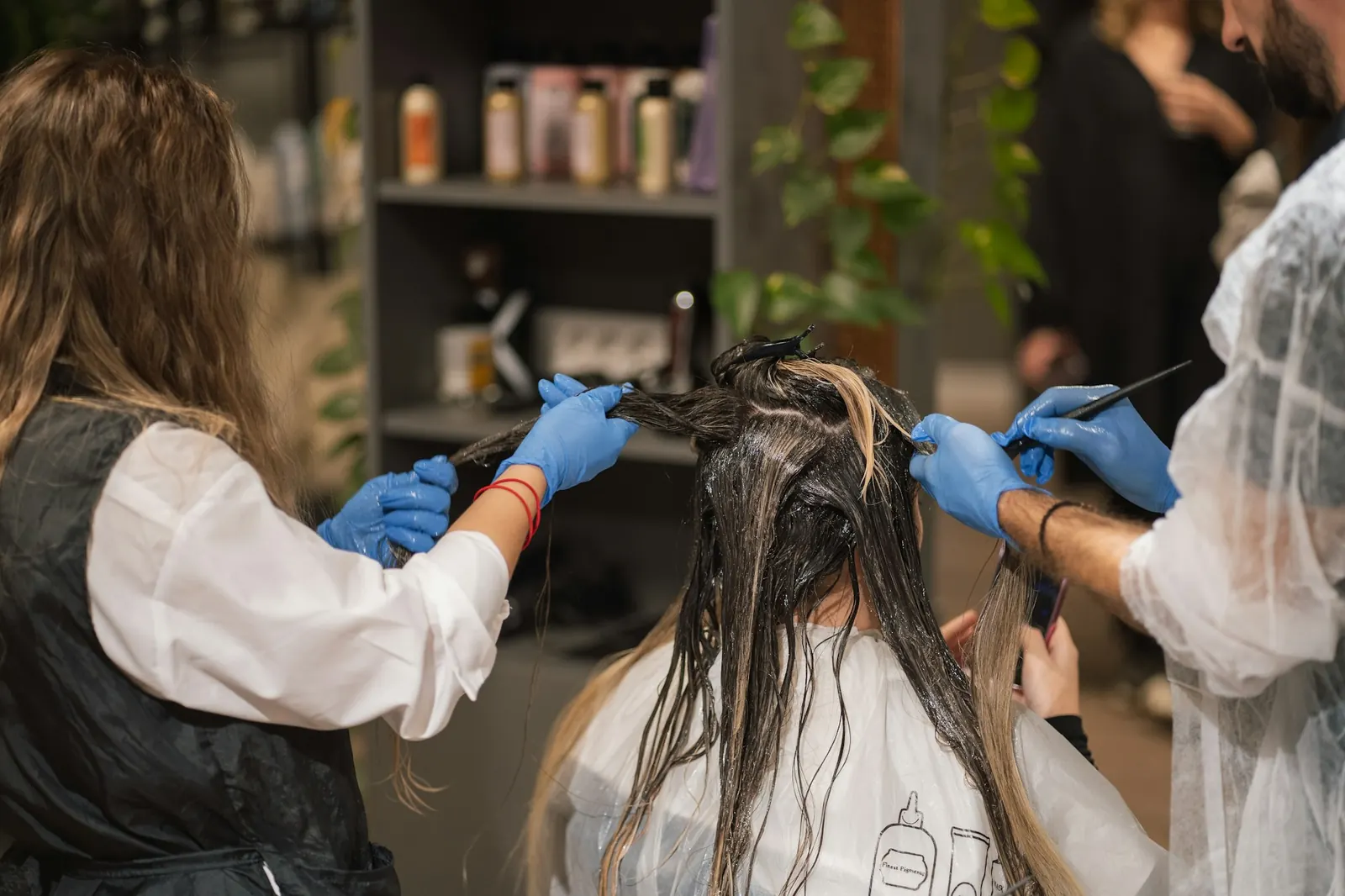 Colorists applying hair color in the salon