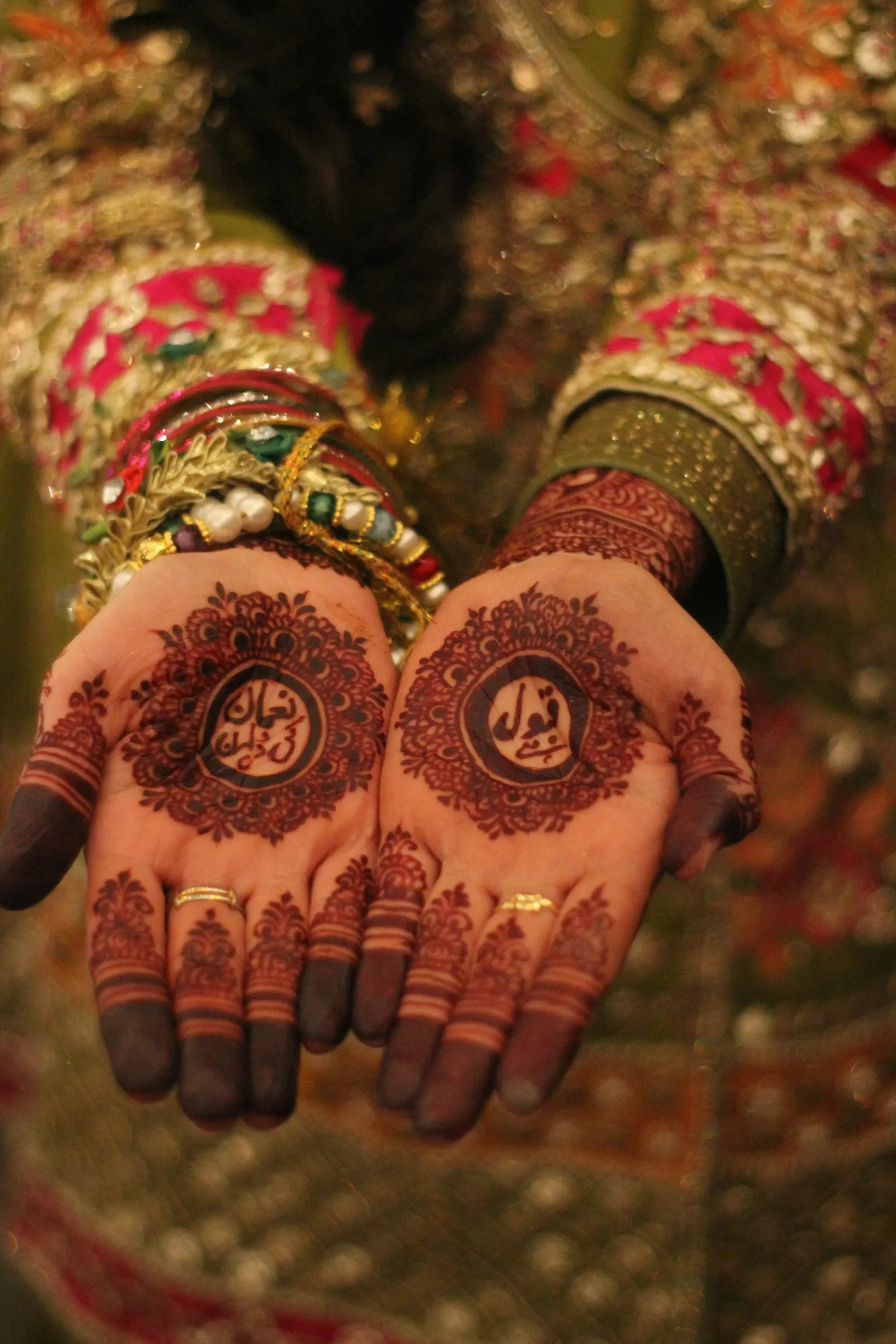 Hands decorated with intricate henna