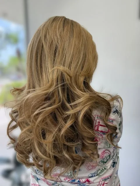 Honey blonde curls, done at Artistic Trendz